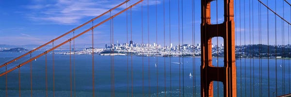 San Francisco Skylines: Suspension bridge with a city in the background, Golden Gate Bridge, San Francisco, California, USA by Panoramic Images