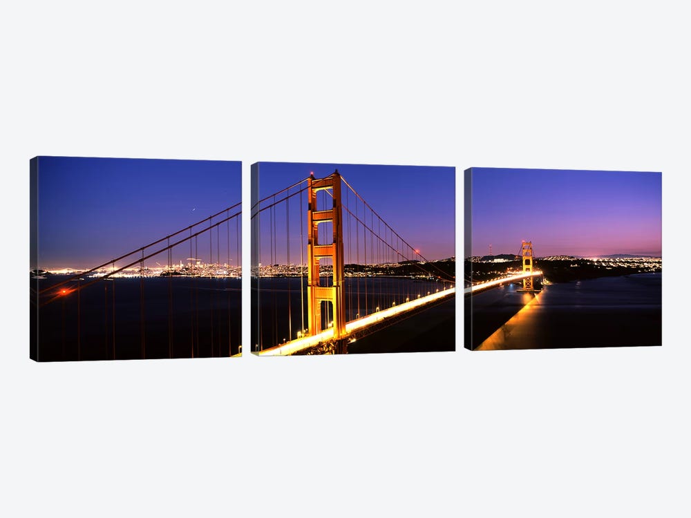Suspension bridge lit up at dusk, Golden Gate Bridge, San Francisco, California, USA by Panoramic Images 3-piece Canvas Print
