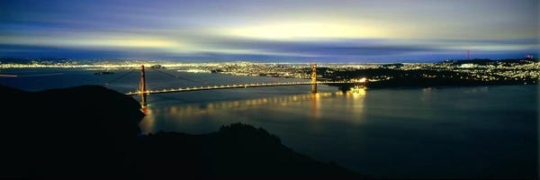 Golden Gate Bridge: Suspension bridge lit up at dusk II, Golden Gate Bridge, San Francisco Bay, San Francisco, California, USA by Panoramic Images