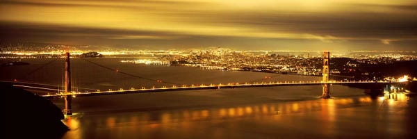 Golden Gate Bridge: Suspension bridge lit up at dusk, Golden Gate Bridge, San Francisco, California, USA by Panoramic Images