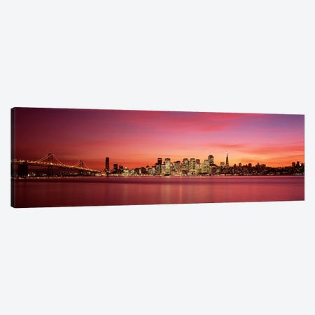 Suspension bridge with city skyline at duskBay Bridge, San Francisco Bay, San Francisco, California, USA Canvas Print #PIM7596} by Panoramic Images Canvas Art