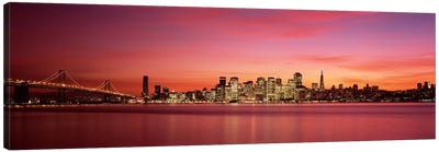 Suspension bridge with city skyline at duskBay Bridge, San Francisco Bay, San Francisco, California, USA Canvas Art Print - San Francisco Skylines
