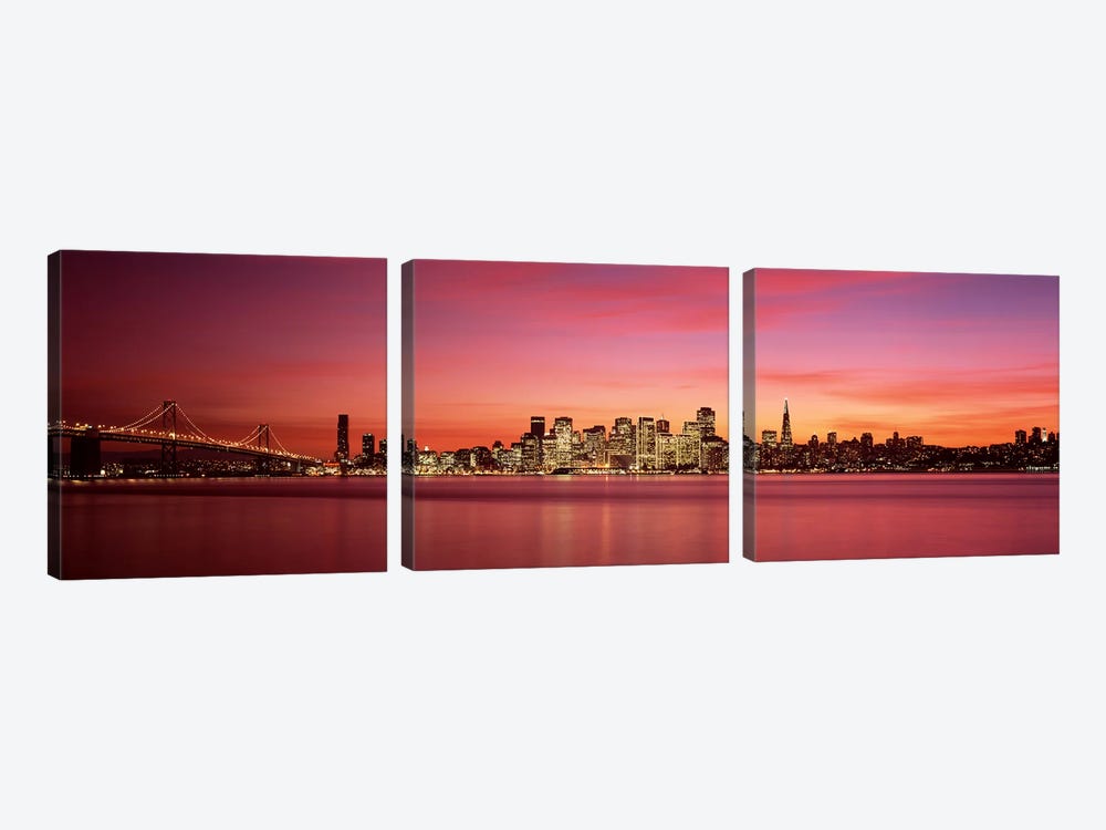Suspension bridge with city skyline at duskBay Bridge, San Francisco Bay, San Francisco, California, USA by Panoramic Images 3-piece Art Print