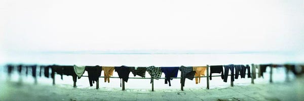 India: Clothes drying at the riverbank, Ganges River, Varanasi, Uttar Pradesh, India by Panoramic Images