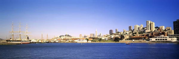 San Francisco Skylines: Sea with a city in the background, Coit Tower, Ghirardelli Square, San Francisco, California, USA by Panoramic Images
