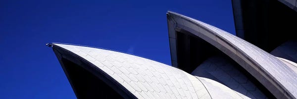 Blue: Low angle view of opera house sails, Sydney Opera House, Sydney Harbor, Sydney, New South Wales, Australia by Panoramic Images