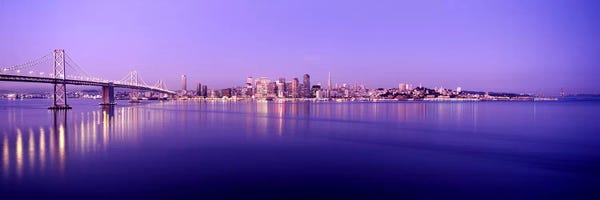San Francisco Skylines: Bridge across a bay with city skyline in the background, Bay Bridge, San Francisco Bay, San Francisco, California, USA by Panoramic Images