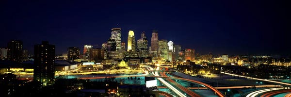 Buildings lit up at night in a cityMinneapolis, Hennepin County, Minnesota, USA