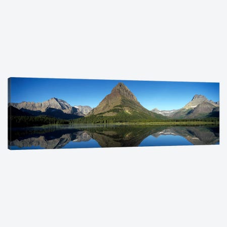 Mount Wilbur And Its Reflection In Swiftcurrent Lake, Many Glacier Region, Glacier National Park, Montana, USA Canvas Print #PIM7878} by Panoramic Images Canvas Artwork