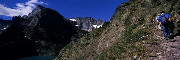 Montana: Hikers hiking on a mountain, US Glacier National Park, Montana, USA by Panoramic Images