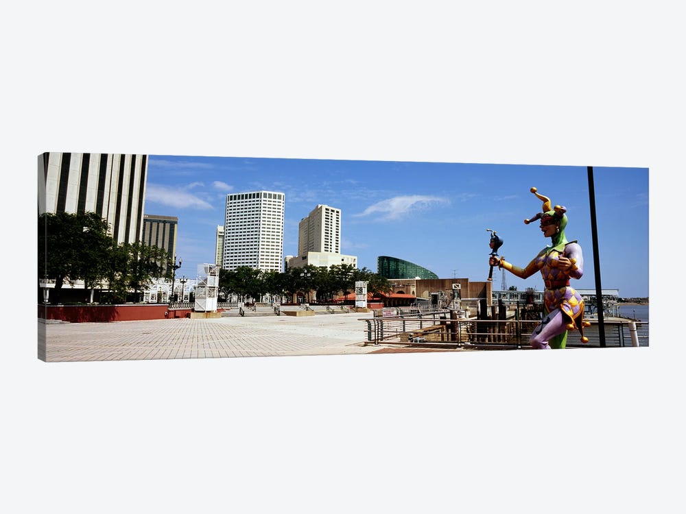 Jester statue with buildings in the background, Riverwalk Area, New Orleans, Louisiana, USA by Panoramic Images 1-piece Canvas Print