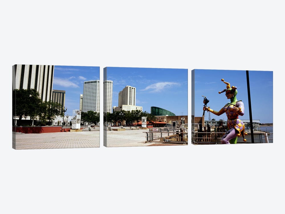 Jester statue with buildings in the background, Riverwalk Area, New Orleans, Louisiana, USA by Panoramic Images 3-piece Canvas Art Print