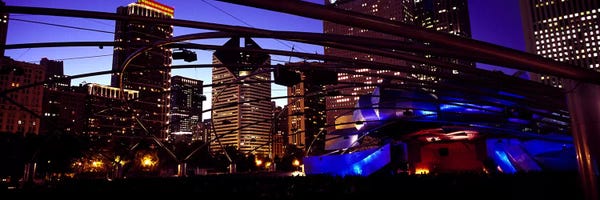 Chicago: Buildings lit up at night, Millennium Park, Chicago, Cook County, Illinois, USA by Panoramic Images