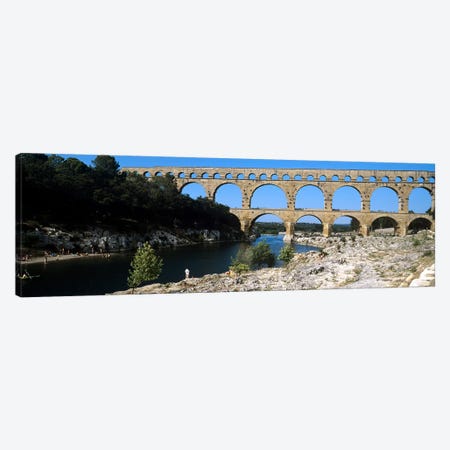 Aqueduct across a river, Pont Du Gard, Nimes, Gard, Languedoc-Rousillon, France Canvas Print #PIM7939} by Panoramic Images Art Print