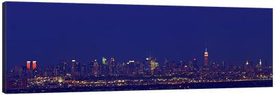 Buildings in a city lit up at night, New York City, New York State, USA Canvas Art Print - Night Sky Art