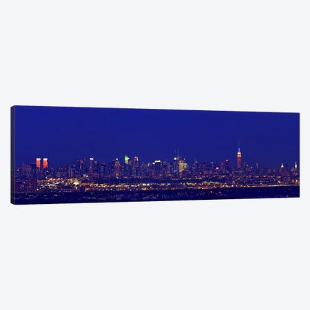 Buildings in a city lit up at night, Upper Manhattan, Manhattan, New York City, New York State, USA Canvas Print #PIM7999} by Panoramic Images Art Print