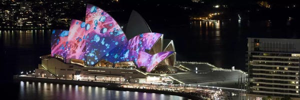 Australia: Opera house lit up at night, Sydney Opera House, Sydney, New South Wales, Australia by Panoramic Images