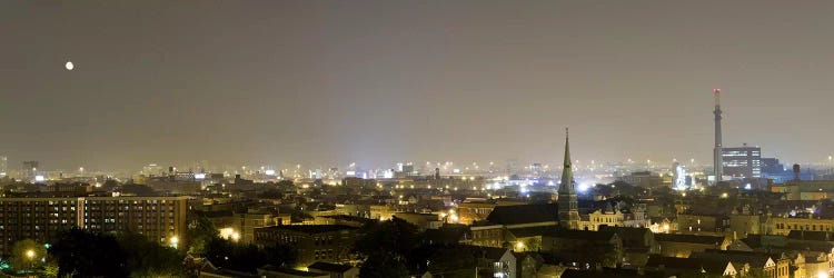 Buildings in a city lit up at night, Pilsen, Chicago, Illinois, USA