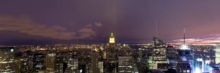 Buildings in a city lit up at dusk, Midtown Manhattan, Manhattan, New York City, New York State, USA