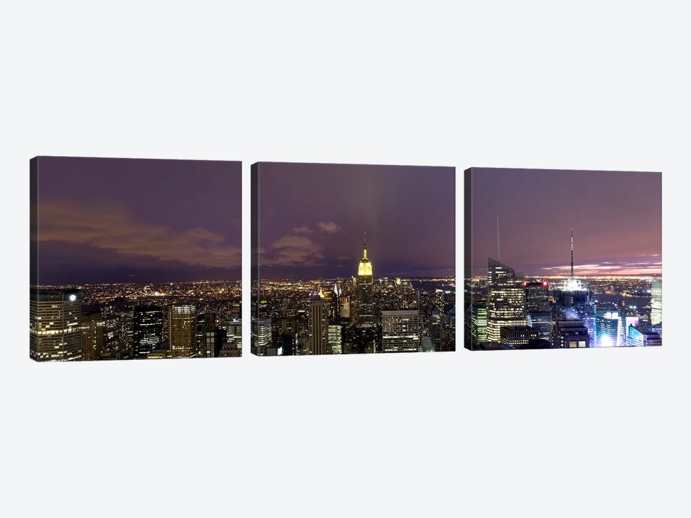 Buildings in a city lit up at dusk, Midtown Manhattan, Manhattan, New York City, New York State, USA by Panoramic Images 3-piece Art Print