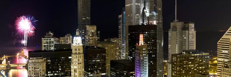 Skyscrapers and firework display in a city at night, Lake Michigan, Chicago, Illinois, USA