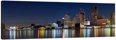 Buildings in a city lit up at dusk, Detroit River, Detroit, Michigan, USA Canvas Art Print - Michigan Art