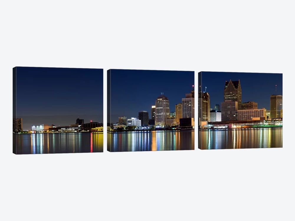 Buildings in a city lit up at dusk, Detroit River, Detroit, Michigan, USA by Panoramic Images 3-piece Canvas Print