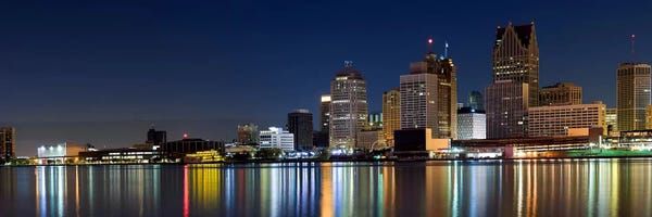 Michigan: Buildings in a city lit up at dusk, Detroit River, Detroit, Michigan, USA by Panoramic Images