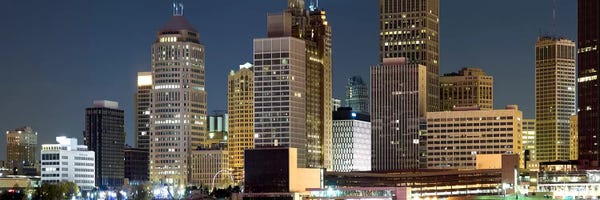 Detroit: Buildings in a city lit up at night, Detroit River, Detroit, Michigan, USA by Panoramic Images