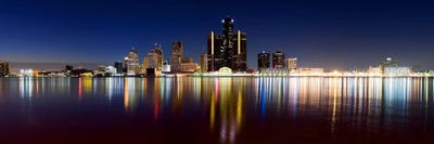 Buildings in a city lit up at duskDetroit River, Det - Canvas Wall Art