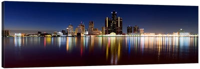 Buildings in a city lit up at duskDetroit River, Detroit, Michigan, USA Canvas Art Print - Michigan Art