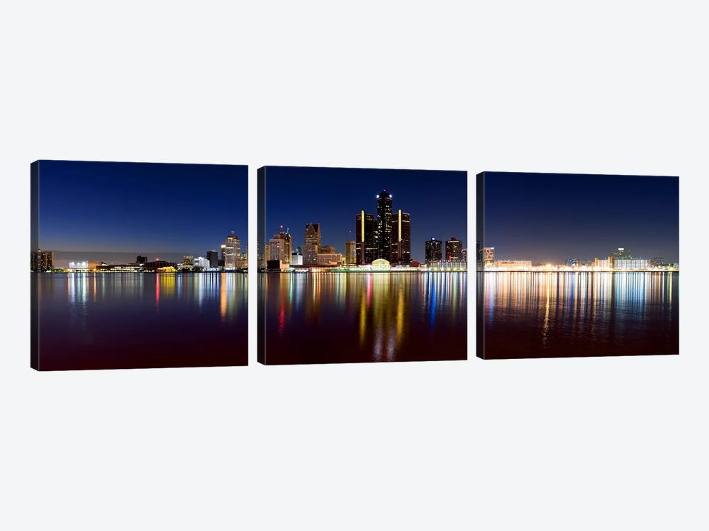 Buildings in a city lit up at duskDetroit River, Detroit, Michigan, USA by Panoramic Images 3-piece Canvas Artwork