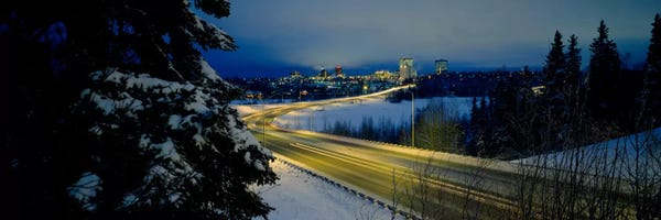 Winding road running through a snow covered landscape, Anchorage, Alaska, USA