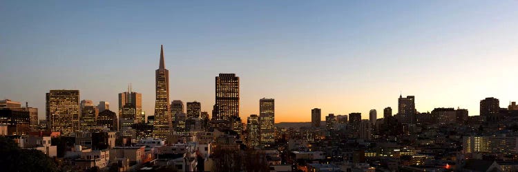 Buildings lit up at dusk, Telegraph Hill, San Francisco, California, USA