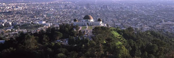 Observatory on a hill with cityscape in the background, Griffith Park Observatory, Los Angeles, California, USA 2010