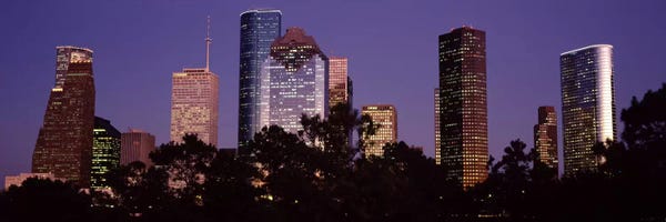 Buildings in a city lit up at duskHouston, Harris county, Texas, USA