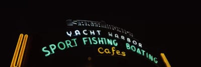 Low angle view of a neon signboard, Santa Monica Pier, Santa Monica, Los Angeles County, California, USA by Panoramic Images multi panel art