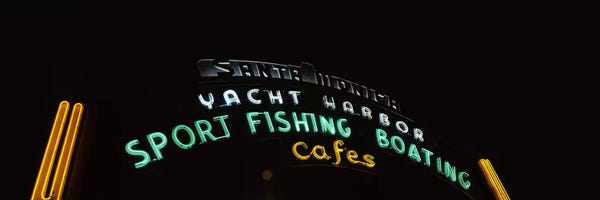 Santa Monica: Low angle view of a neon signboard, Santa Monica Pier, Santa Monica, Los Angeles County, California, USA by Panoramic Images
