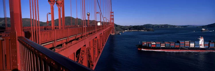 Container ship passing under a suspension bridge, Golden Gate Bridge, San Francisco Bay, San Francisco, California, USA