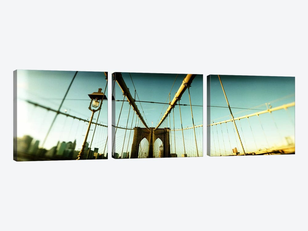 Suspension bridge with a city in the background, Brooklyn Bridge, Manhattan, New York City, New York State, USA by Panoramic Images 3-piece Art Print