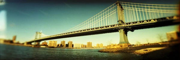 Brooklyn Bridge: Suspension bridge with a city in the backgroundBrooklyn Bridge, Manhattan, New York City, New York State, USA by Panoramic Images
