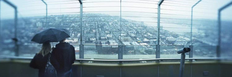 Couple viewing a city from the Space Needle, Queen Anne Hill, Seattle, Washington State, USA