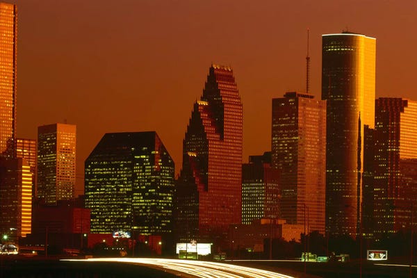 City Sunrises & Sunsets: Skyscrapers in a city at sunset, Houston, Texas, USA by Panoramic Images