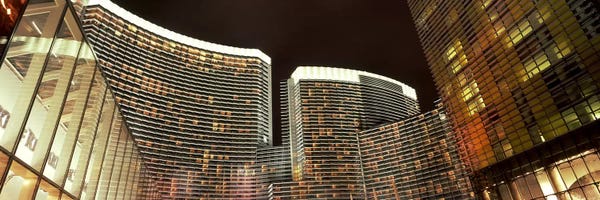 Nevada: Skyscrapers lit up at night, Citycenter, The Strip, Las Vegas, Nevada, USA by Panoramic Images