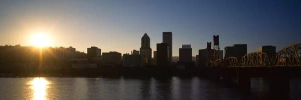 Oregon: Buildings along the waterfront at sunset, Willamette River, Portland, Oregon, USA by Panoramic Images