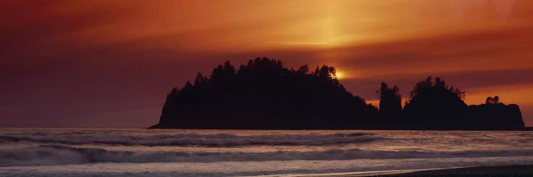 Silhouette of sea stack at sunrise, Washington State, USA