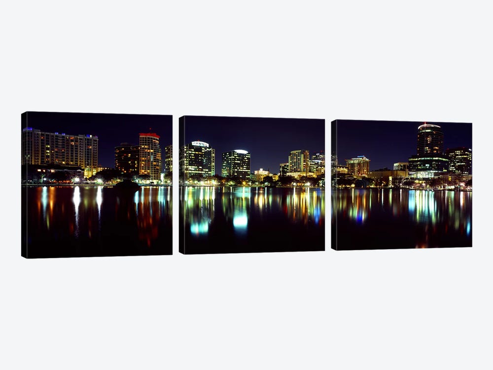 Buildings lit up at night in a city, Lake Eola, Orlando, Orange County, Florida, USA 2010 by Panoramic Images 3-piece Art Print