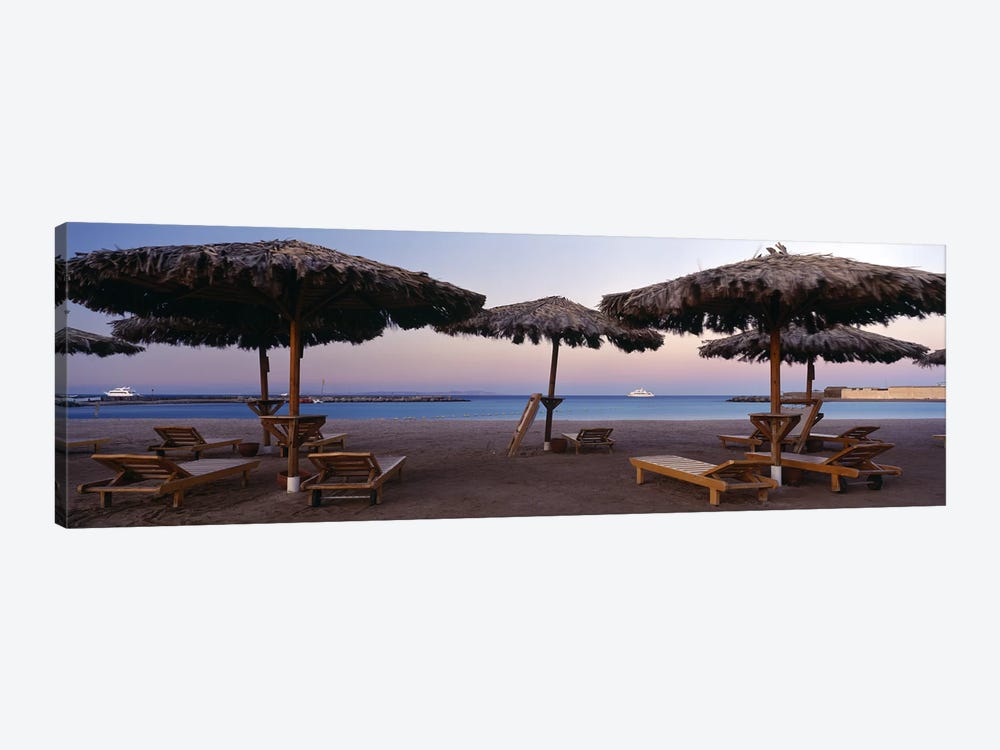 Lounge chairs with sunshades on the beach, Hilton Resort, Hurghada, Egypt by Panoramic Images 1-piece Art Print
