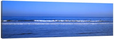 Surfers riding a wave in the sea, Santa Monica, Los Angeles County, California, USA Canvas Art Print