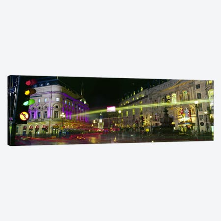 Blurred Motion View Of Nighttime Lights, Piccadilly Circus, London, England Canvas Print #PIM8767} by Panoramic Images Art Print